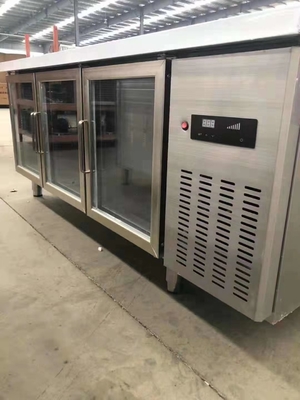 Stainless steel commercial refrigerator workbench in the back kitchen of hotel restaurant